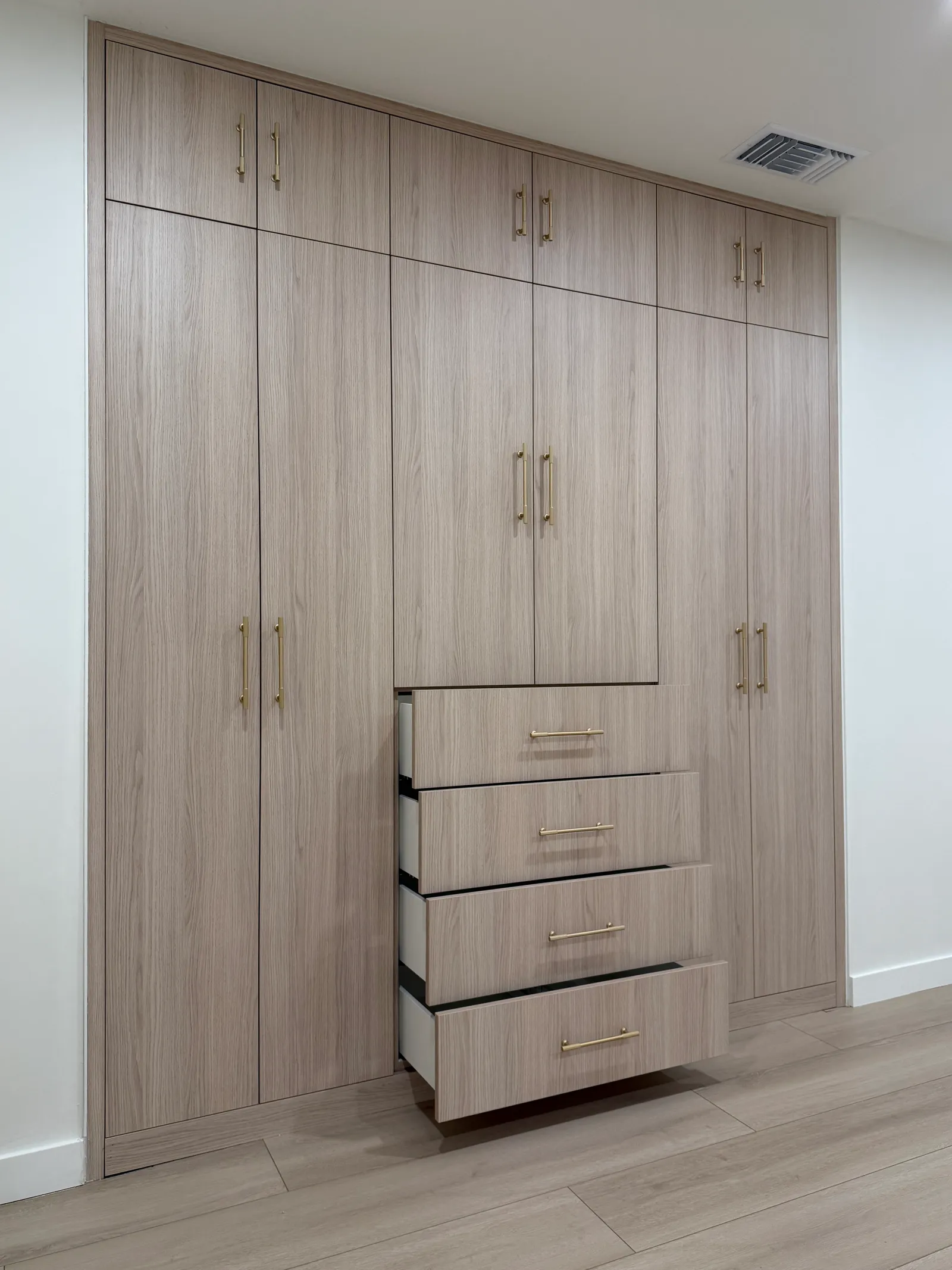 Custom wood-look wardrobe with drawers and built-in storage in Tujunga