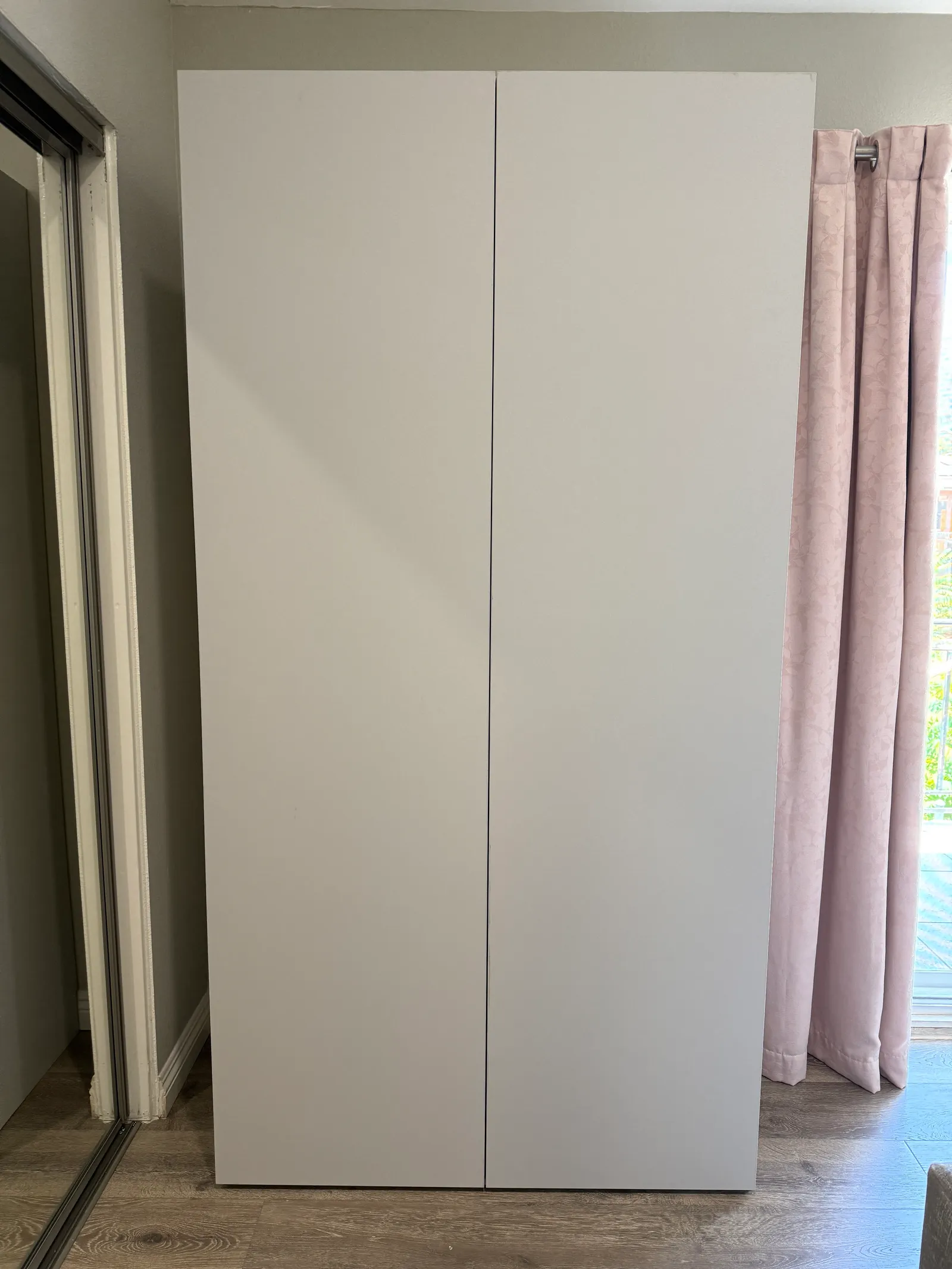 Full-height custom bedroom wardrobe with push-to-open melamine doors in Tujunga