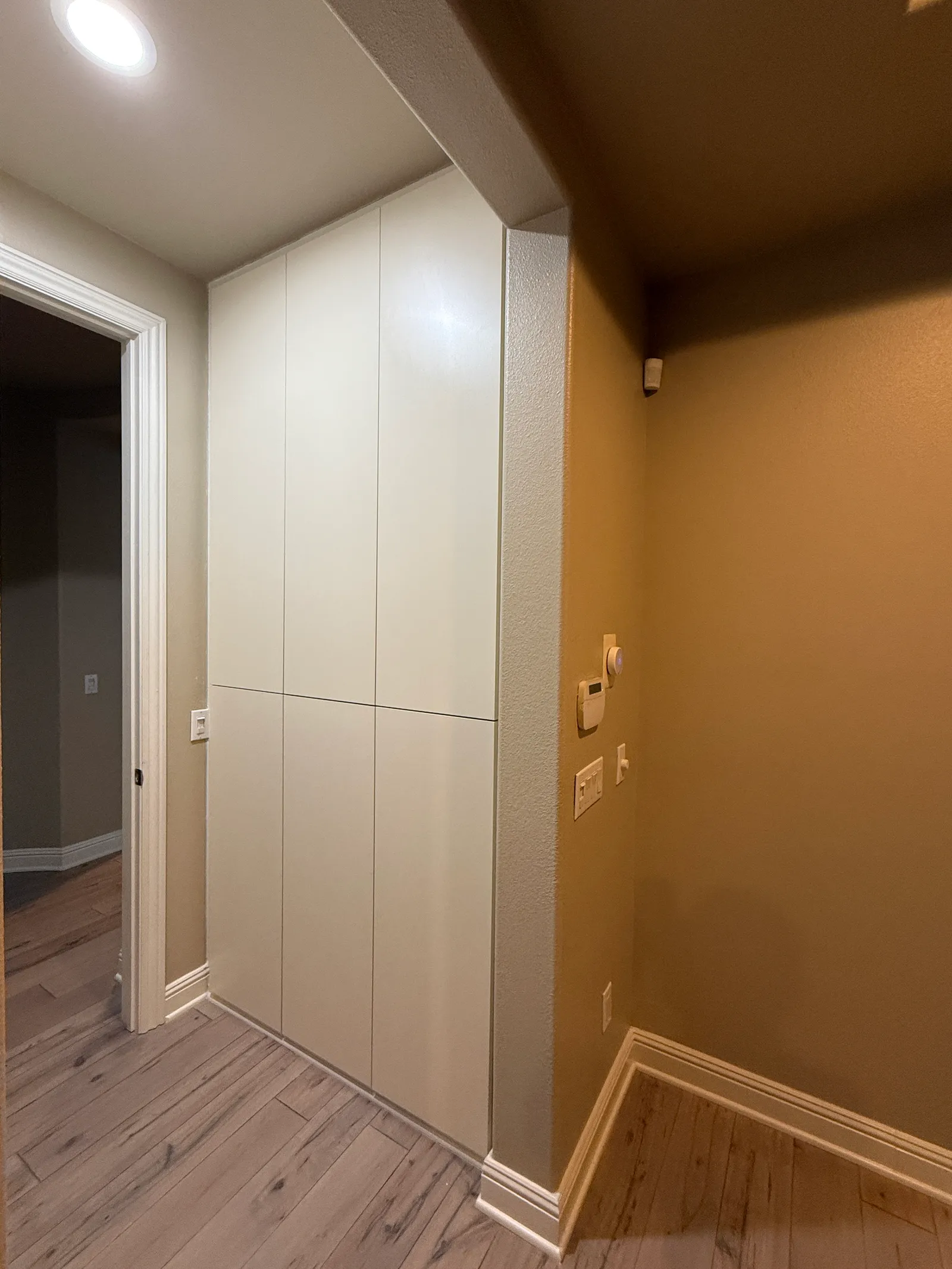 Custom utility storage cabinetry with clean white doors in Porter Ranch