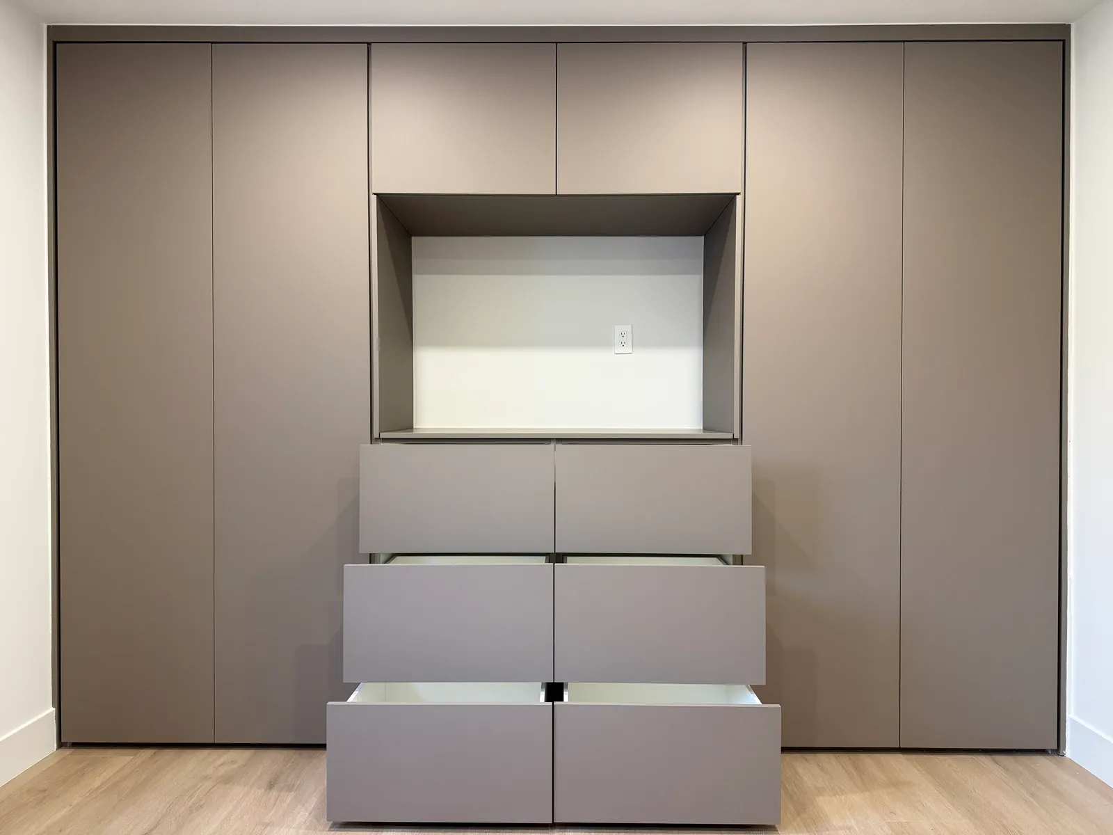 Full-height custom bedroom wall unit with recessed niche and built-in drawers in North Hollywood