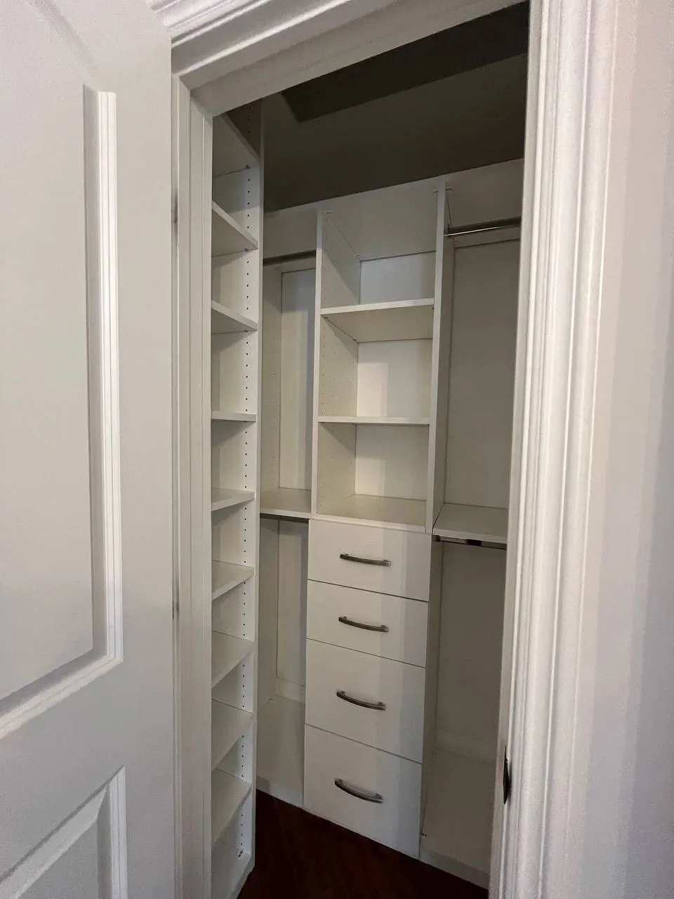 Compact white melamine walk-in closet with drawers and shelving in Glendale
