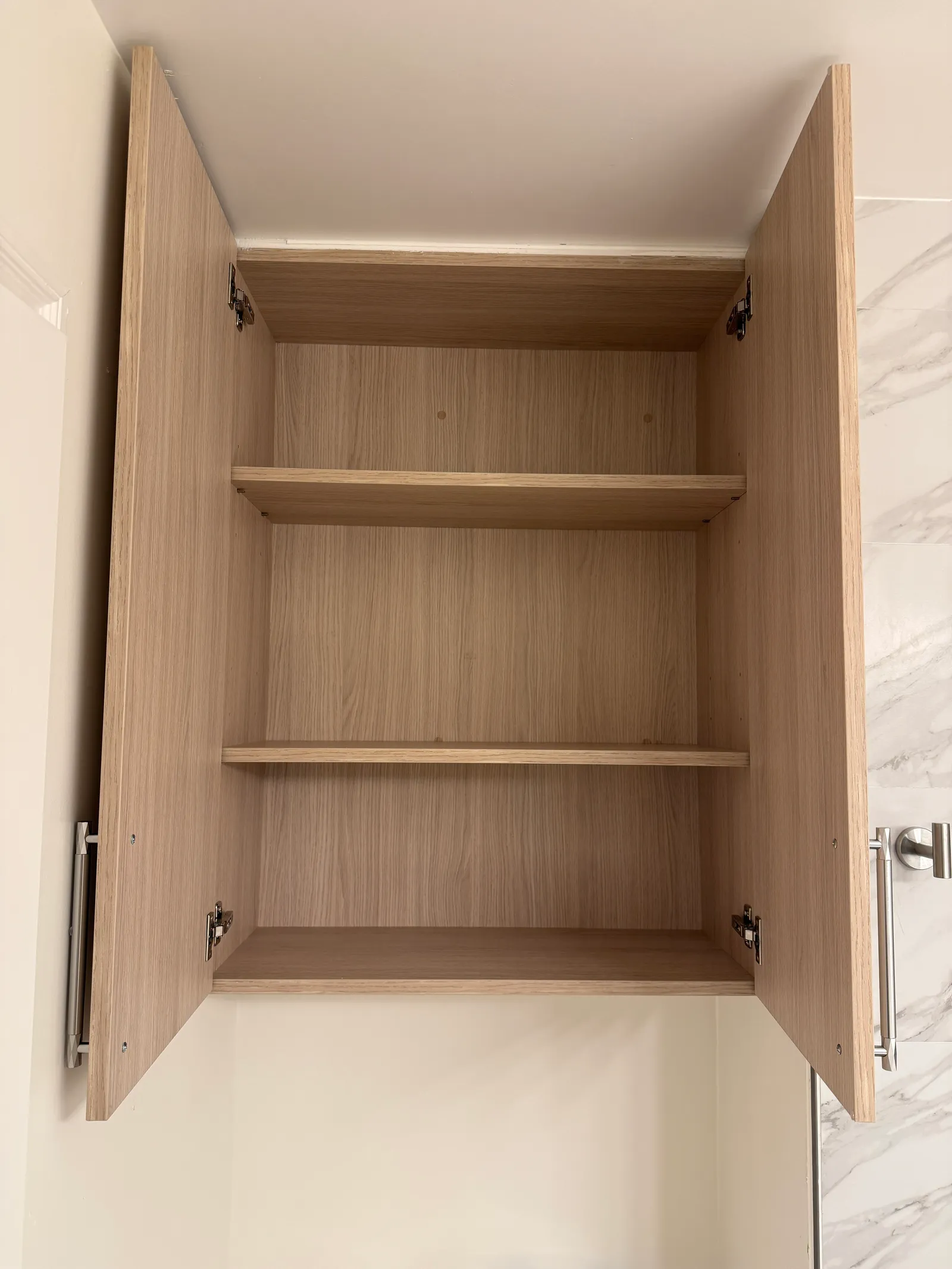 Interior shelving inside matching custom storage cabinet in Tujunga