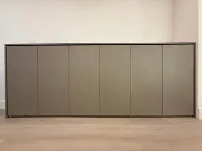 Low custom hallway cabinet with handle-free doors