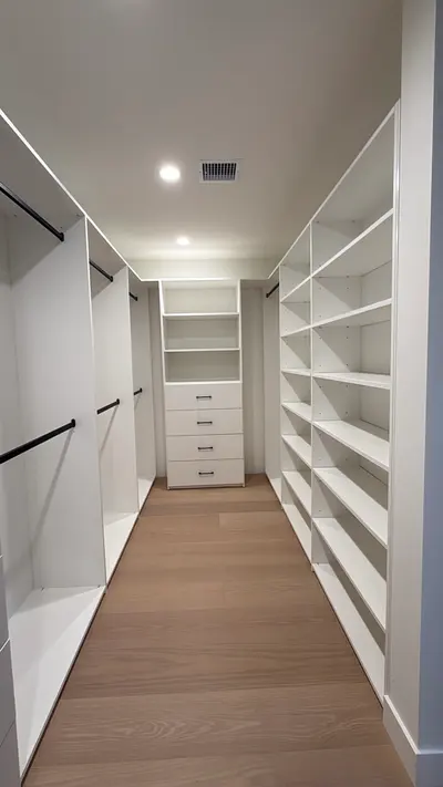 Built-in drawers and adjustable shelving in a custom Sun Valley walk-in closet