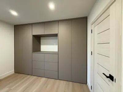 Custom North Hollywood bedroom cabinetry with central niche and drawers