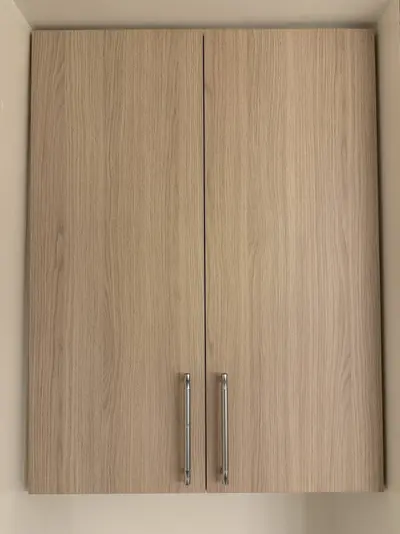 Matching wood-look storage cabinet with double doors in Tujunga