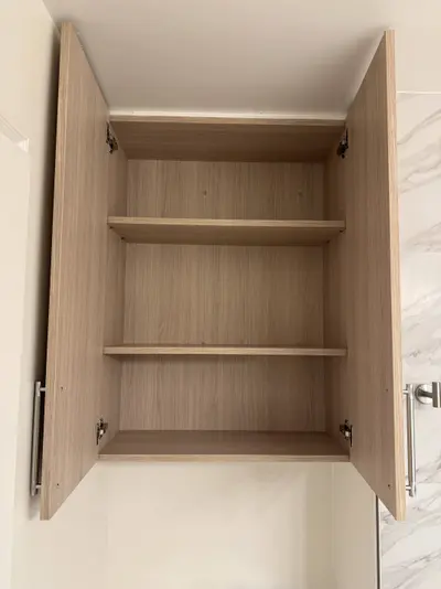 Interior shelving inside matching custom storage cabinet
