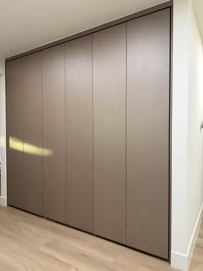 Detail of matte melamine panels on custom hallway cabinetry